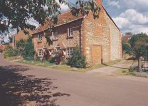 This Grade II Listed semi-detached cottage is comfortably furnished.