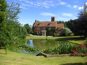 Approach to house with pond