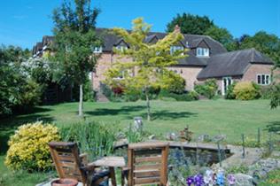 Woodgate Farmhouse, garden seen from guest rooms