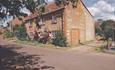This Grade II Listed semi-detached cottage is comfortably furnished.