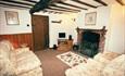 This Grade II Listed semi-detached cottage is comfortably furnished.