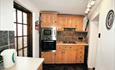 This Grade II Listed semi-detached cottage is comfortably furnished.