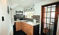 This Grade II Listed semi-detached cottage is comfortably furnished.