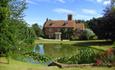 Approach to house with pond