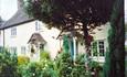 Set in lovely garden with lawn and box hedges