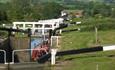 A barge going through one of the locks at Caen Hil