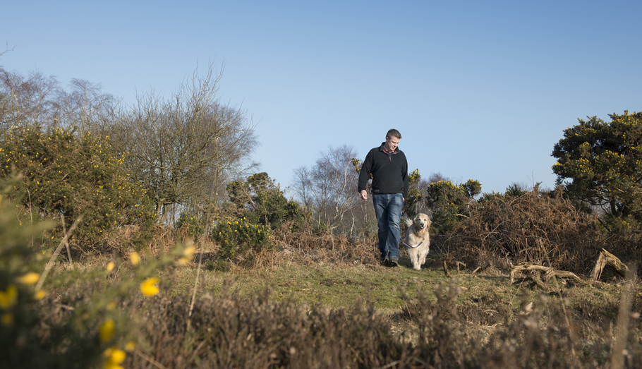 man walking a dog