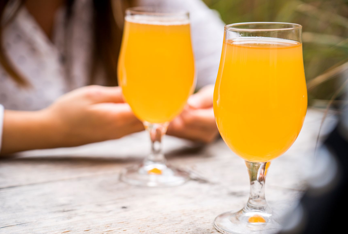 Two glasses of beer on table