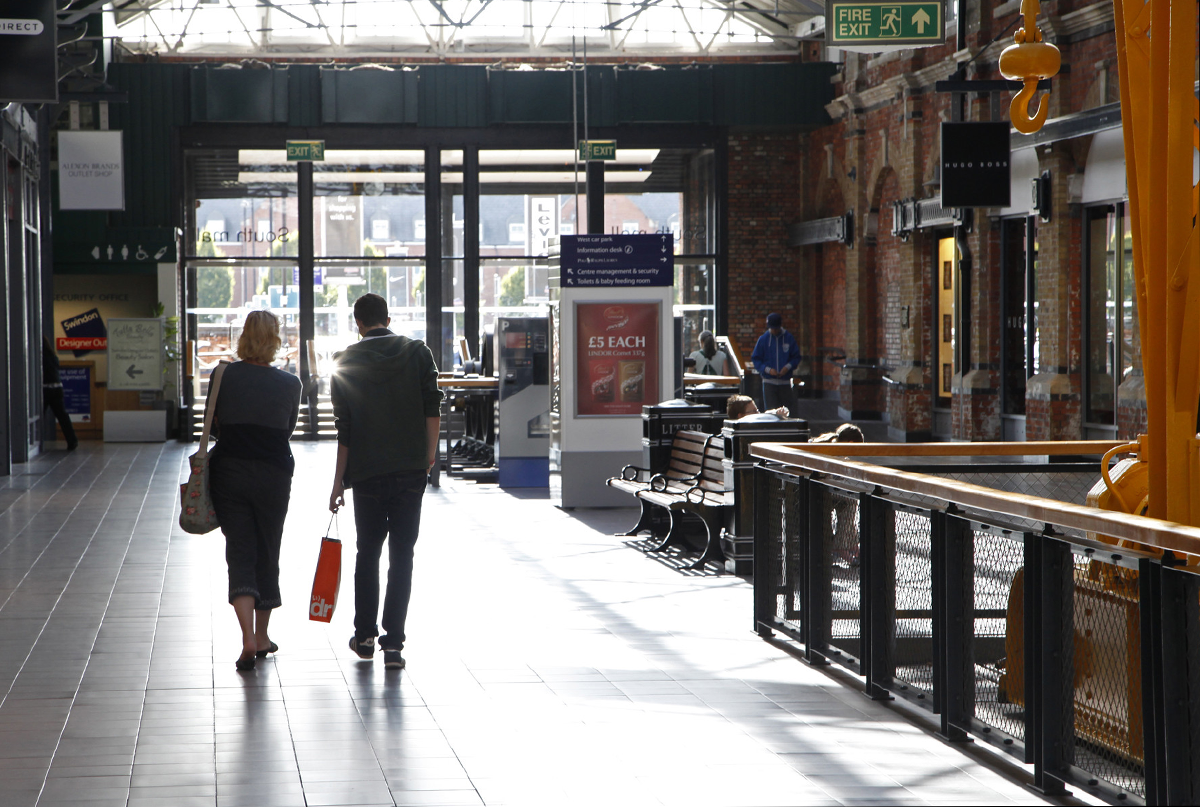 Two people shopping in the shopping centre