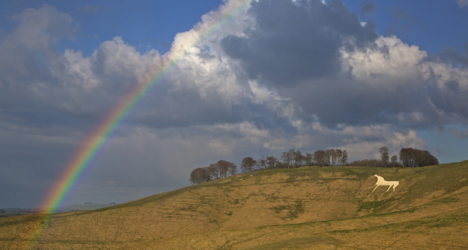 A rainbow over the white horse at Cherhill