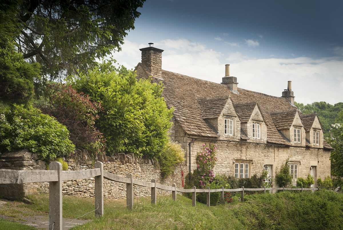 Traditional stone cottages with grass verge