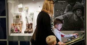 Family looking at museum display