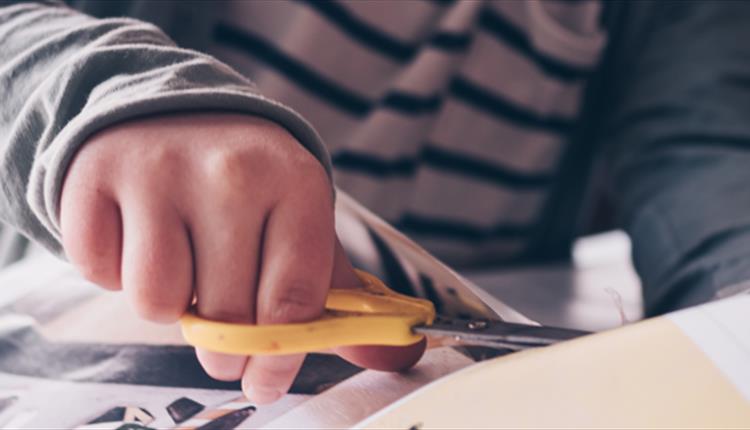 Child cutting paper